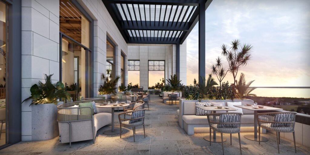 Kasibeyaz rooftop terrace at Dubai Hills Mall, with outdoor tables and a sunset view