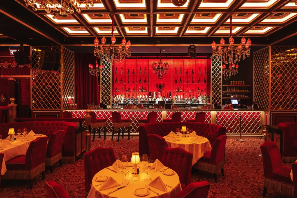 Raspoutine DIFC in Dubai, red-and-gold interior with chandeliers and velvet seating