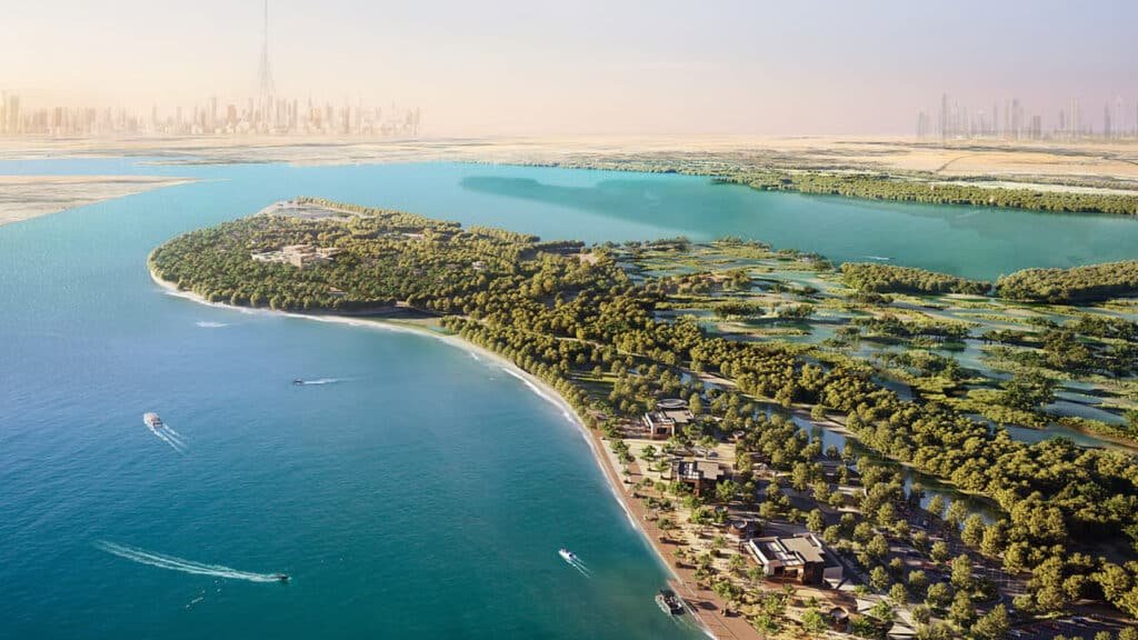 Aerial rendering of a lush waterfront island with beaches, lagoons, residences, boats, and a futuristic city skyline