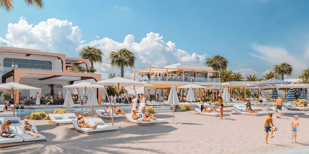 Sirène by Gaïa: Inside Dubai’s Newest Beach Club Modern beach resort with pool, lounge chairs, umbrellas, and people relaxing under palm trees