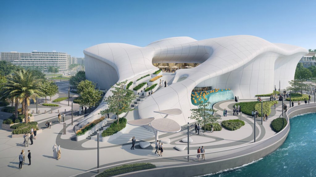 Futuristic white TeamLab Phenomena waterfront building with flowing organic roof forms, terraces, and people gathered around landscaped plazas and water
