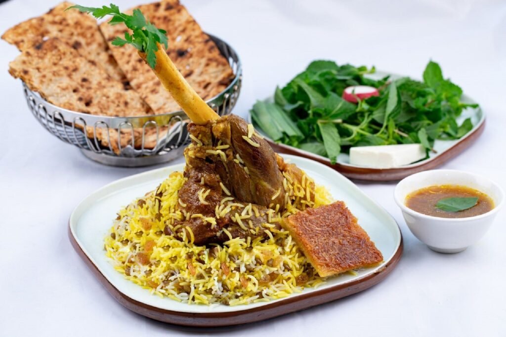 Lamb shank biryani with flatbread and salad at Iran Zamin, Dubai Hills