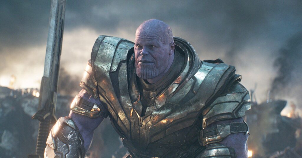 Avengers- Endgame Encore - Thanos, a purple-skinned armoured warrior, stands on a battlefield holding a large double-edged sword