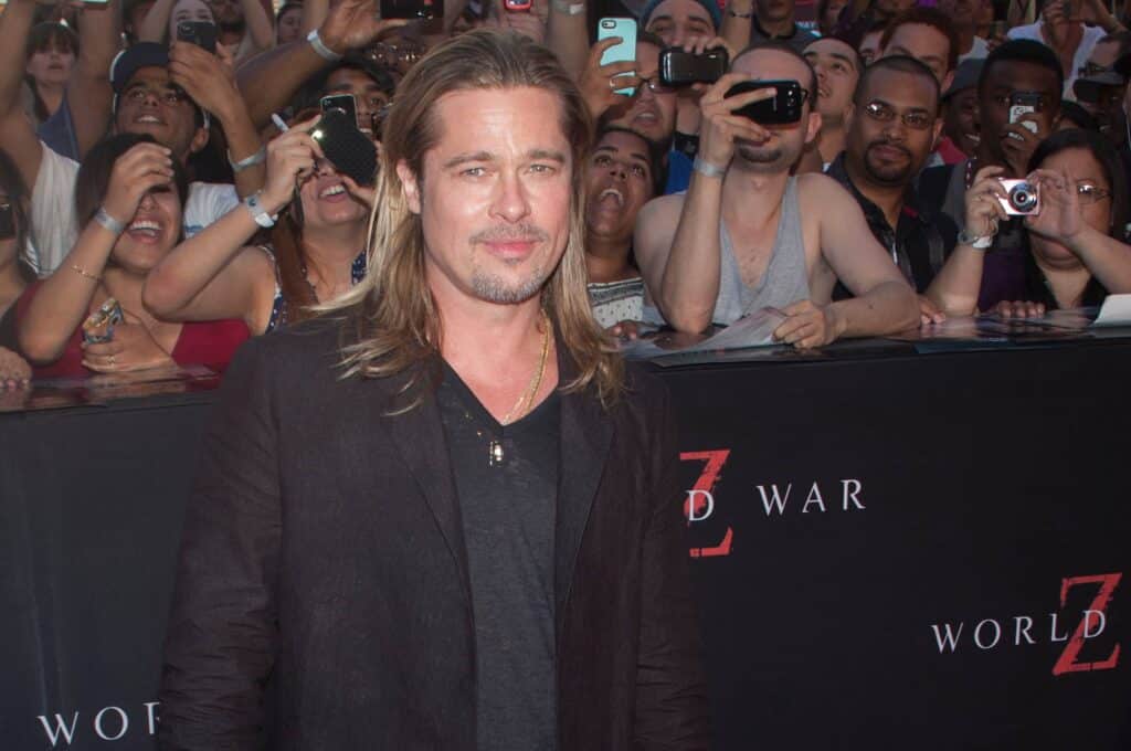 Brad Pitt poses in front of fans and photographers at a “World War Z” event