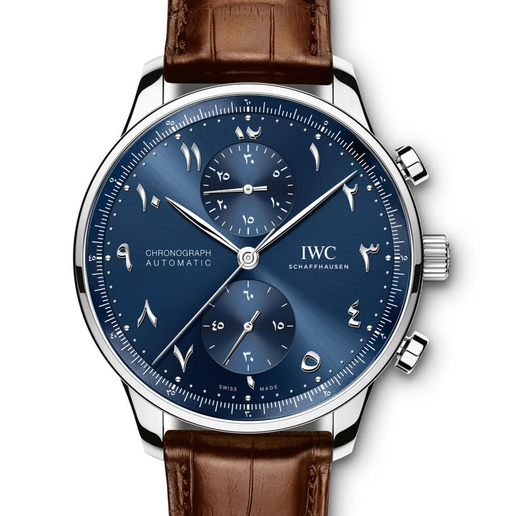 IWC Arabic-Dial Portugieser Chronograph watch with a blue dial, Arabic numerals, silver case, and brown leather strap