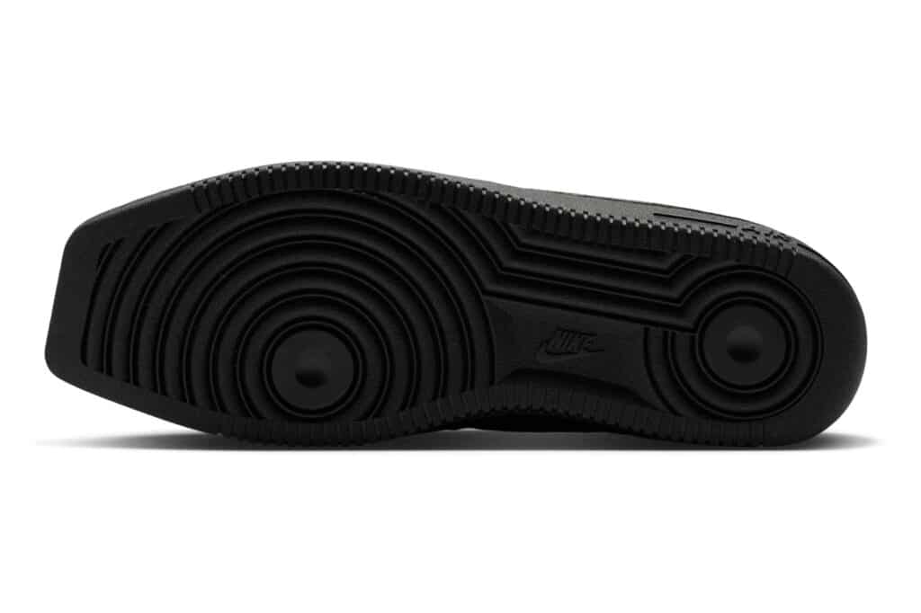 Nike Air Force 1 Low Triple Black sneaker sole with concentric circular tread patterns and textured rubber edges